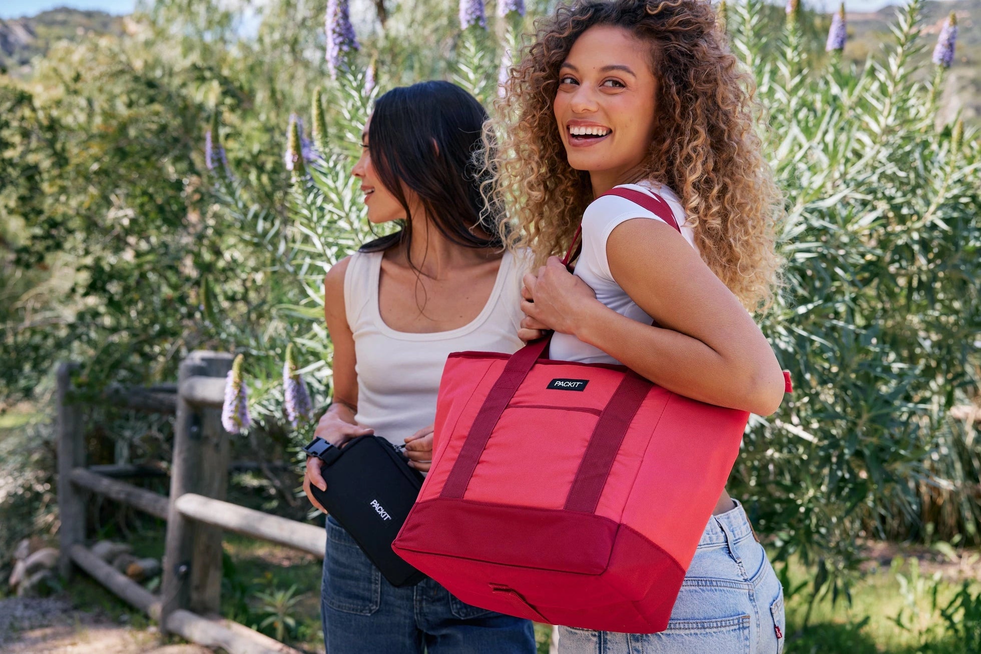 PackIt red freezable 12-can tote carried outdoors